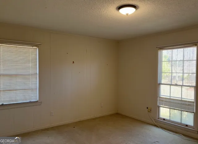 a view of a hallway with windows