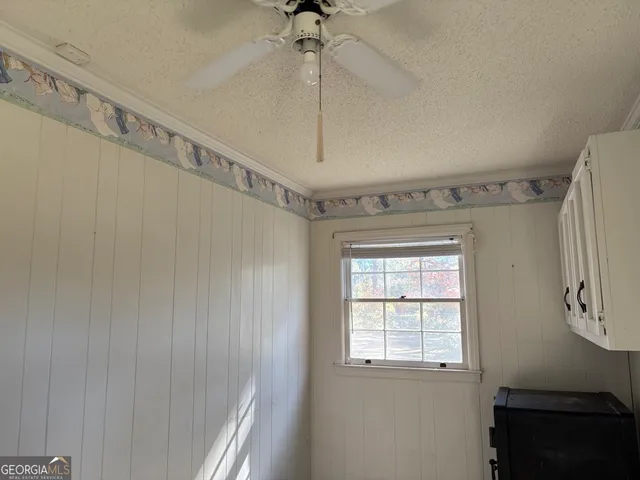 a brick building with a bench in front of it