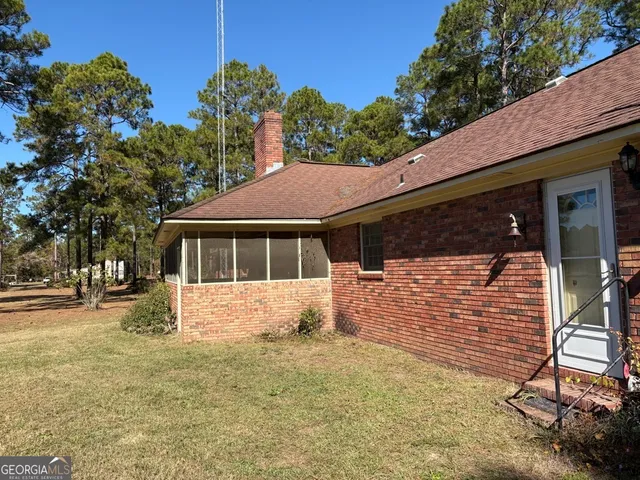 a view of backyard with a small yard