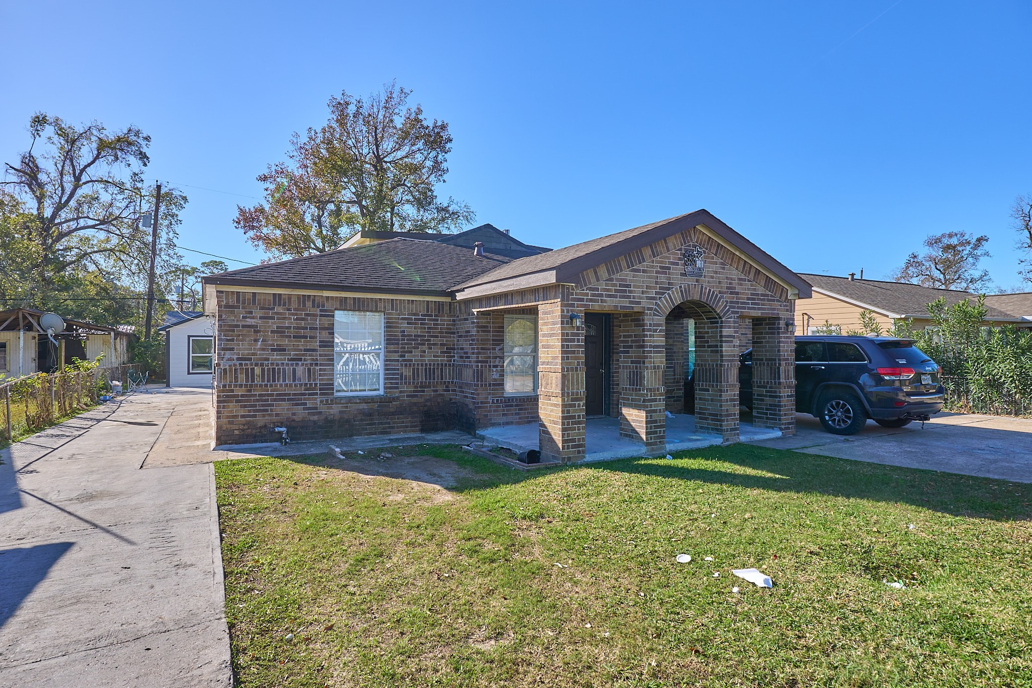 9010 Linda Vista Road Houston, TX 77078 - Photo 2 of 24 a front view of a house with a yard and garage