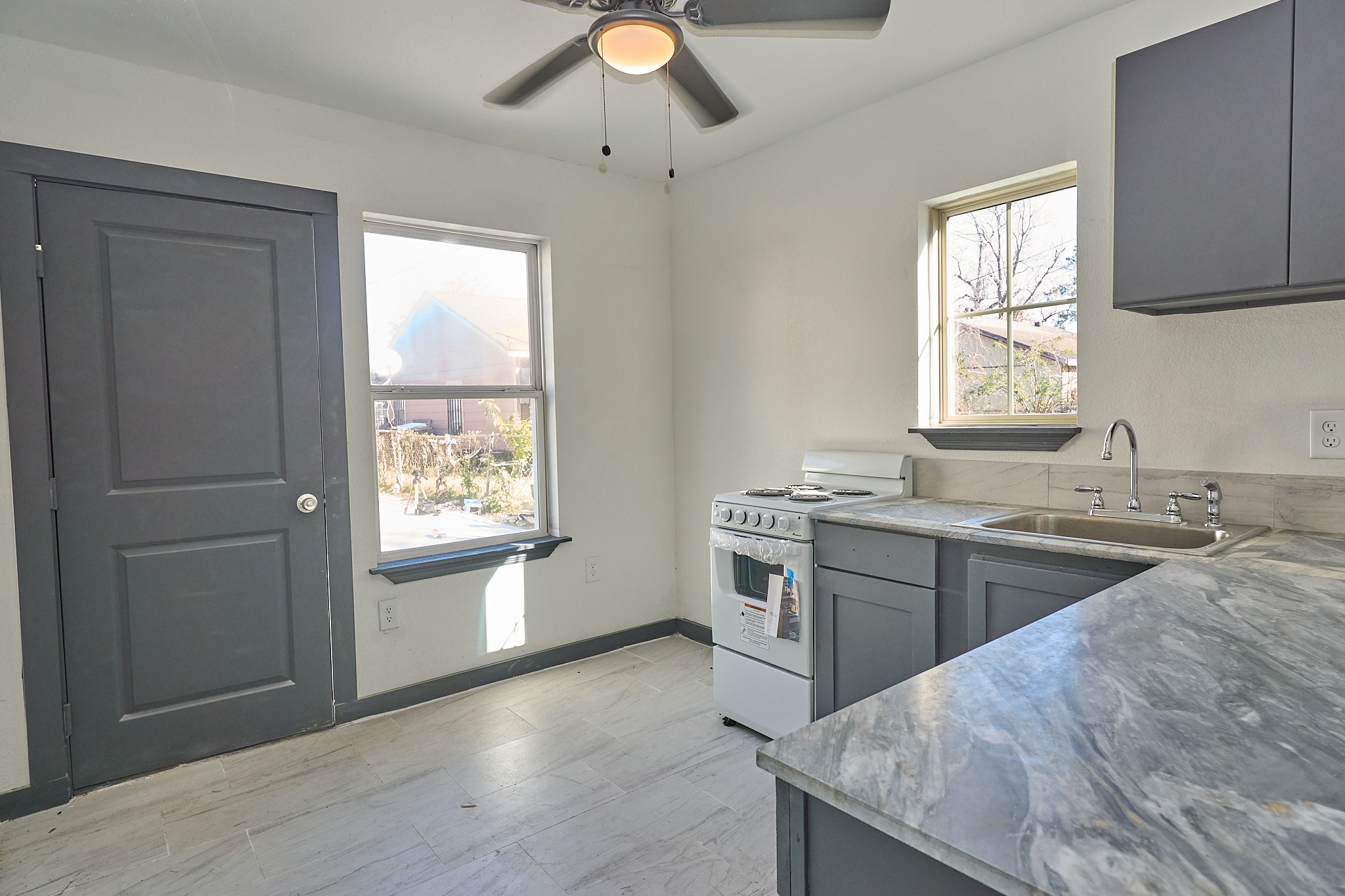 9010 Linda Vista Road Houston, TX 77078 - Photo 10 of 24 a kitchen with a sink stove and cabinets