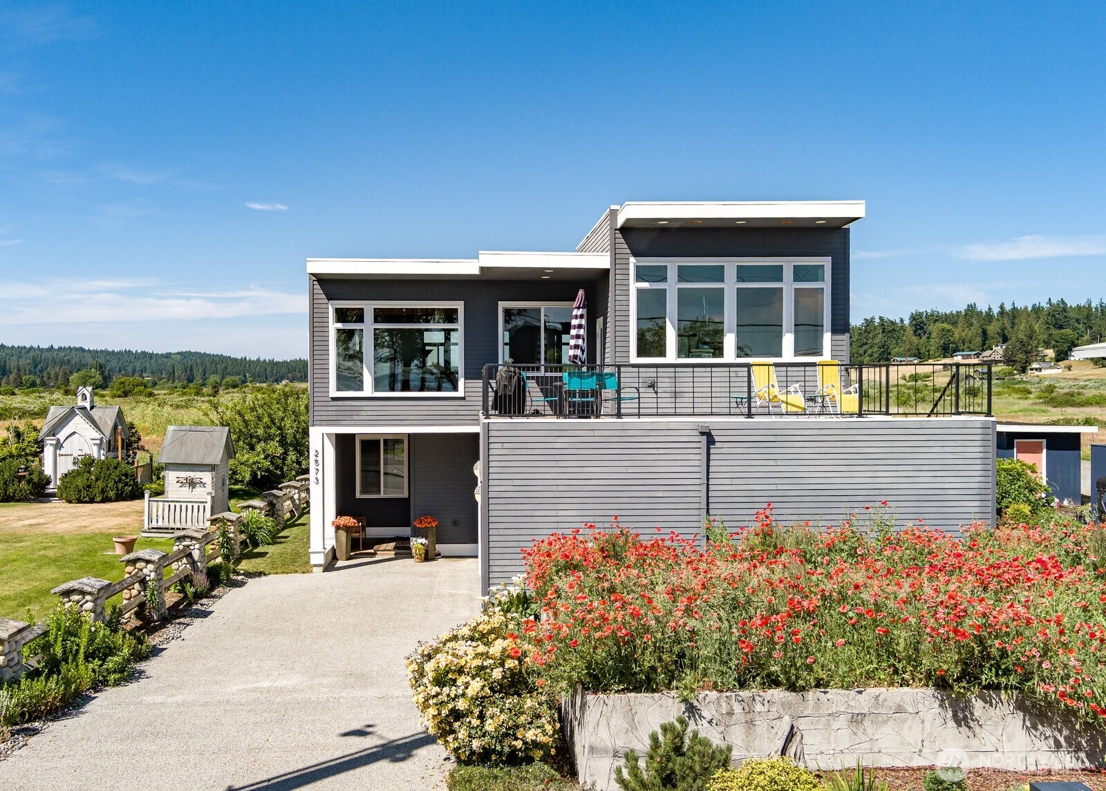 2573 Sunlight Beach Road Clinton, WA 98236 - Photo 2 of 3 a view of a house with outdoor space