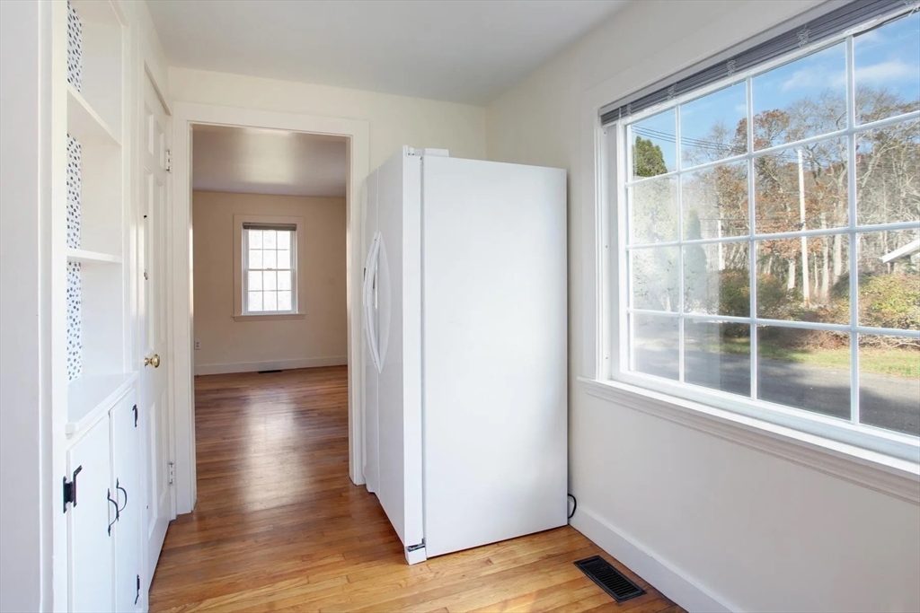 32 Delano Road Marion, MA 02738 - Photo 6 of 31 an empty room with wooden floor and windows