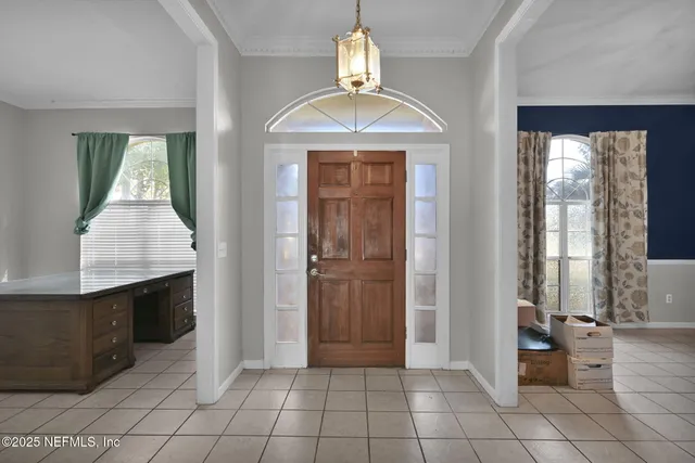 a view of a living room and chandelier