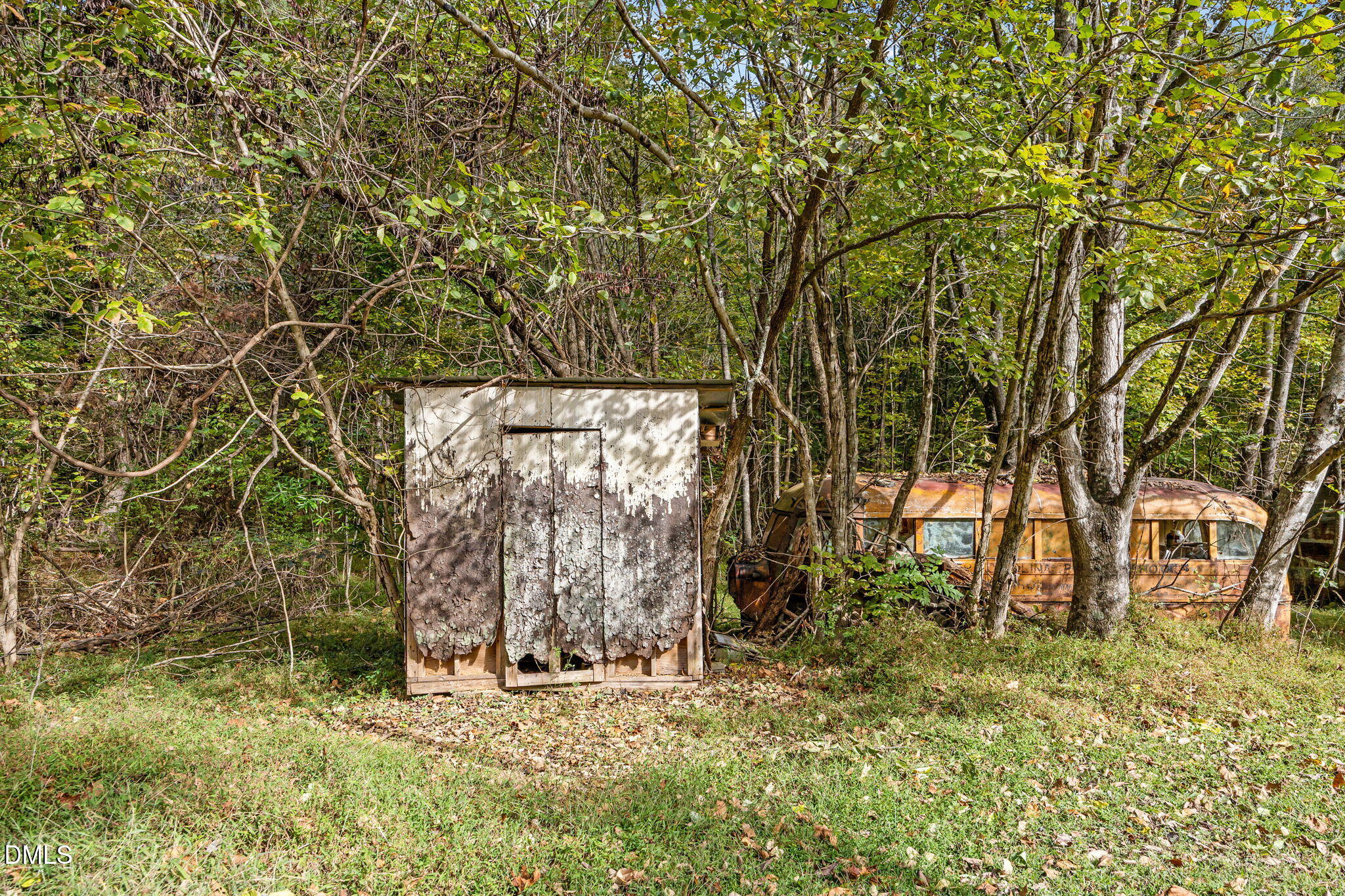 3801 Buckhorn Road Efland, NC 27243 - Photo 22 of 25 a backyard of a house with lots of green space and trees