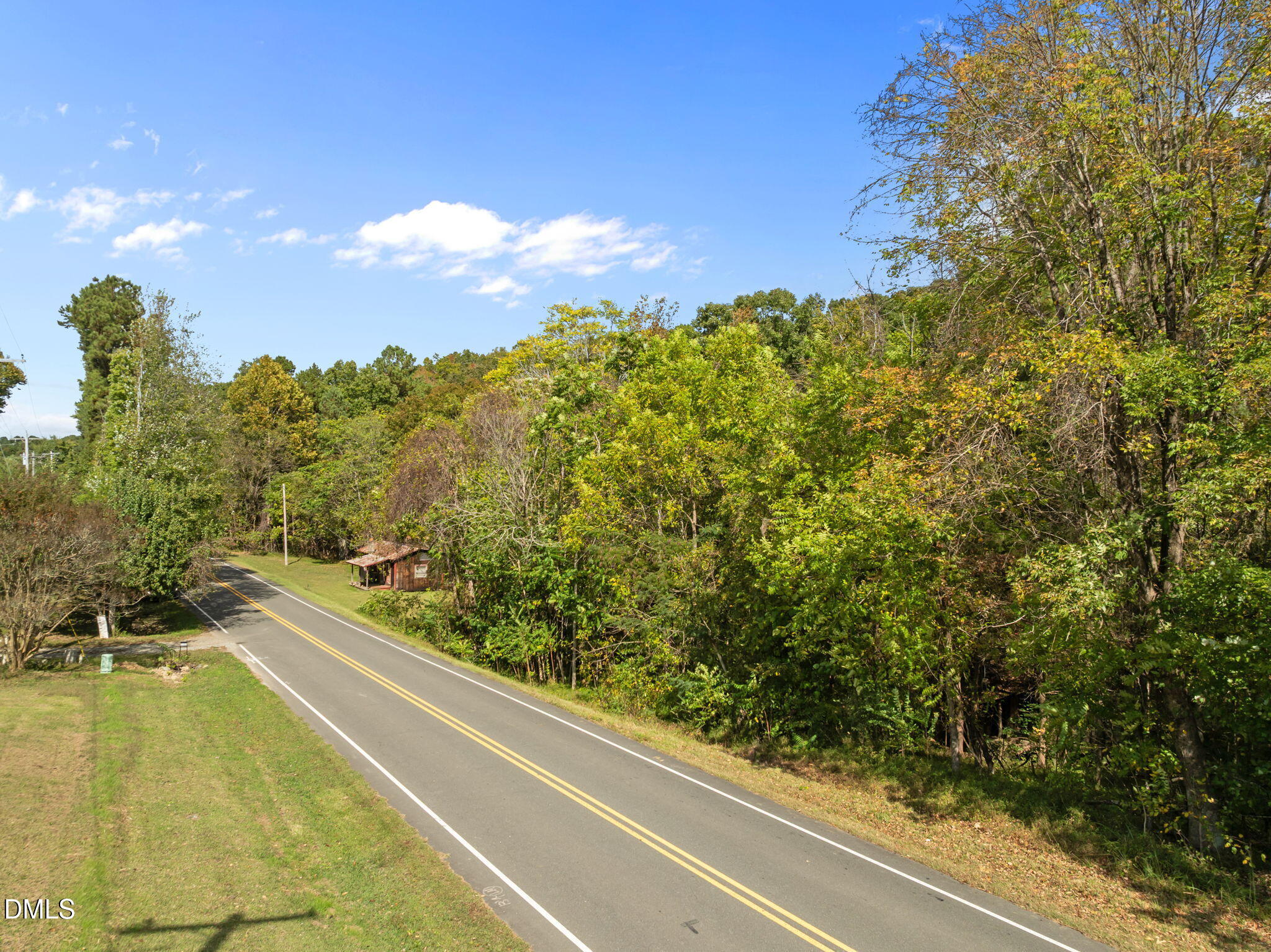 3801 Buckhorn Road Efland, NC 27243 - Photo 7 of 25 a view of a swimming pool and trees in the background