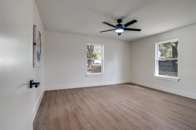 a bathroom with a double vanity sink mirror and toilet