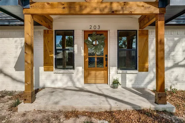 a view of a brick house with a large windows