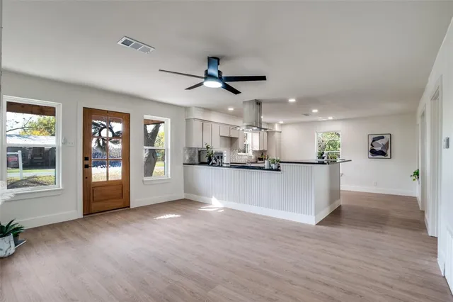 a view of a kitchen with a sink and a stove top oven