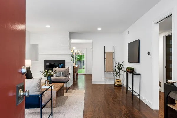a living room with furniture and a fireplace