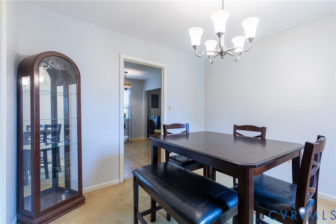 3317 Hastings Road Petersburg, VA 23805 - Photo 11 of 25 a view of a dining room with furniture and wooden floor