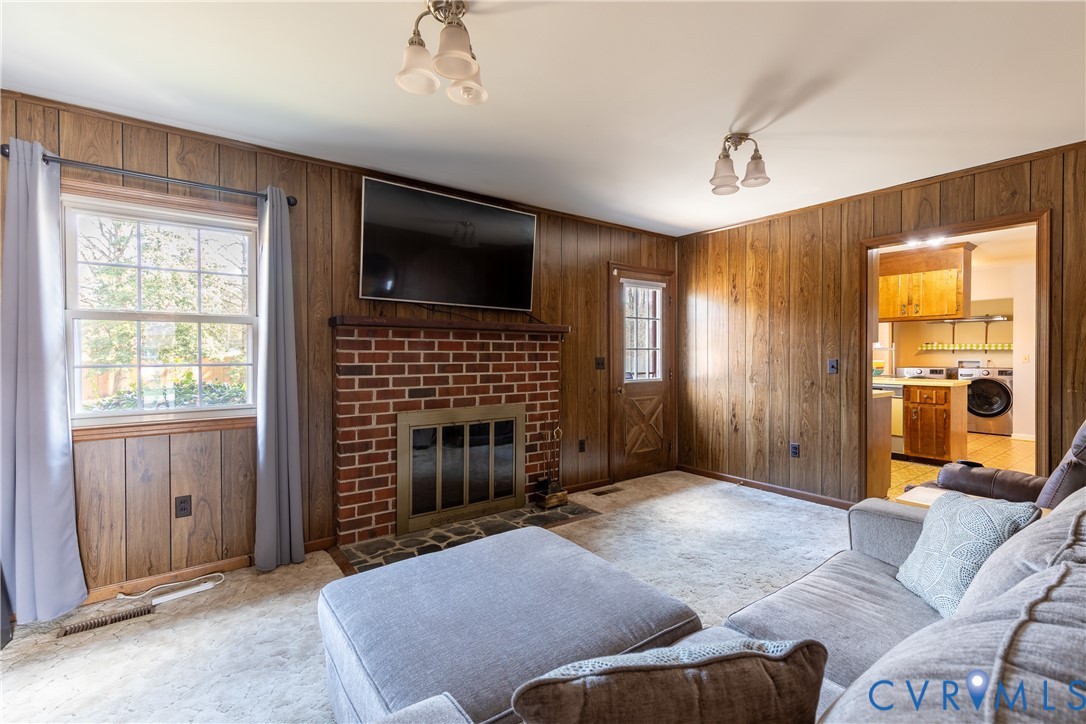 3317 Hastings Road Petersburg, VA 23805 - Photo 12 of 25 a living room with furniture windows and a flat screen tv
