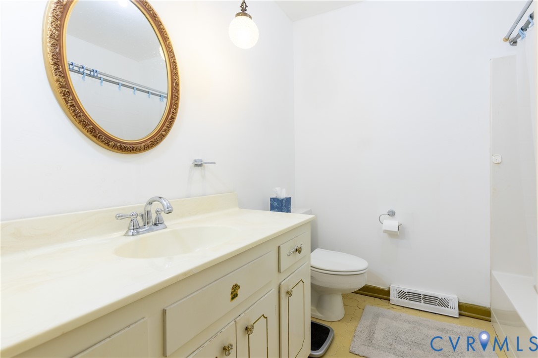 3317 Hastings Road Petersburg, VA 23805 - Photo 14 of 25 a bathroom with a sink and a mirror