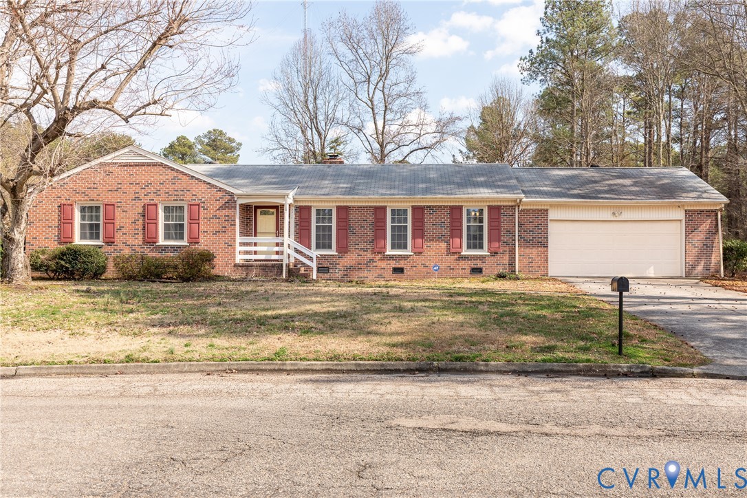 3317 Hastings Road Petersburg, VA 23805 - Photo 2 of 25 a front view of a house with garden