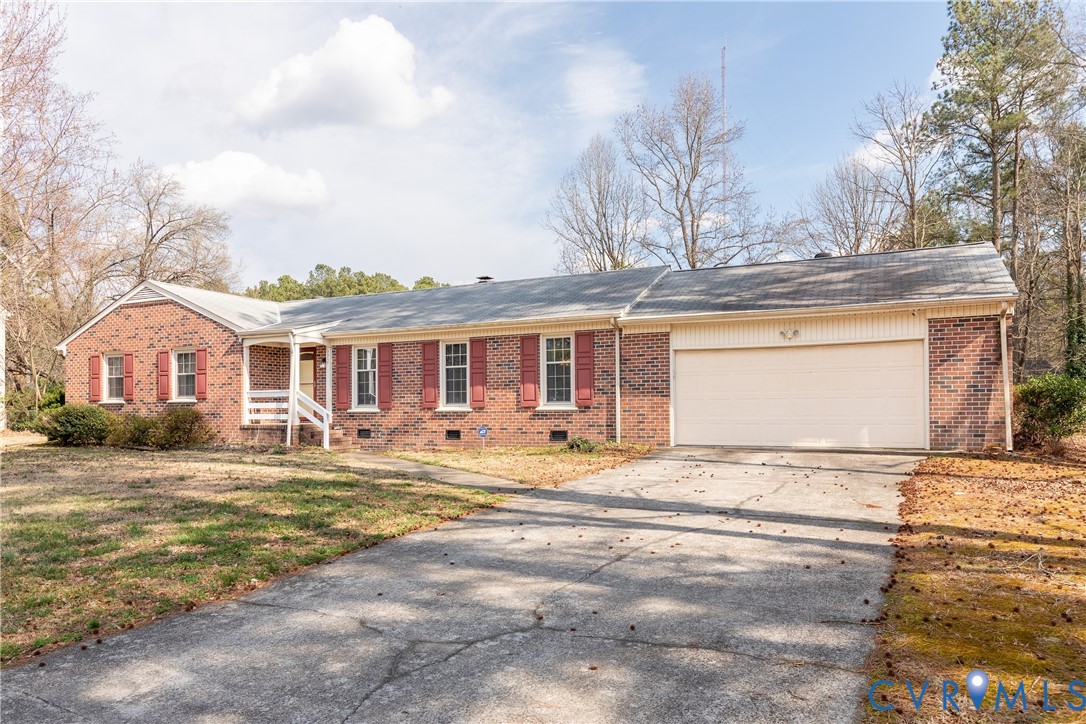 3317 Hastings Road Petersburg, VA 23805 - Photo 23 of 25 a front view of a house with a yard outdoor seating and garage