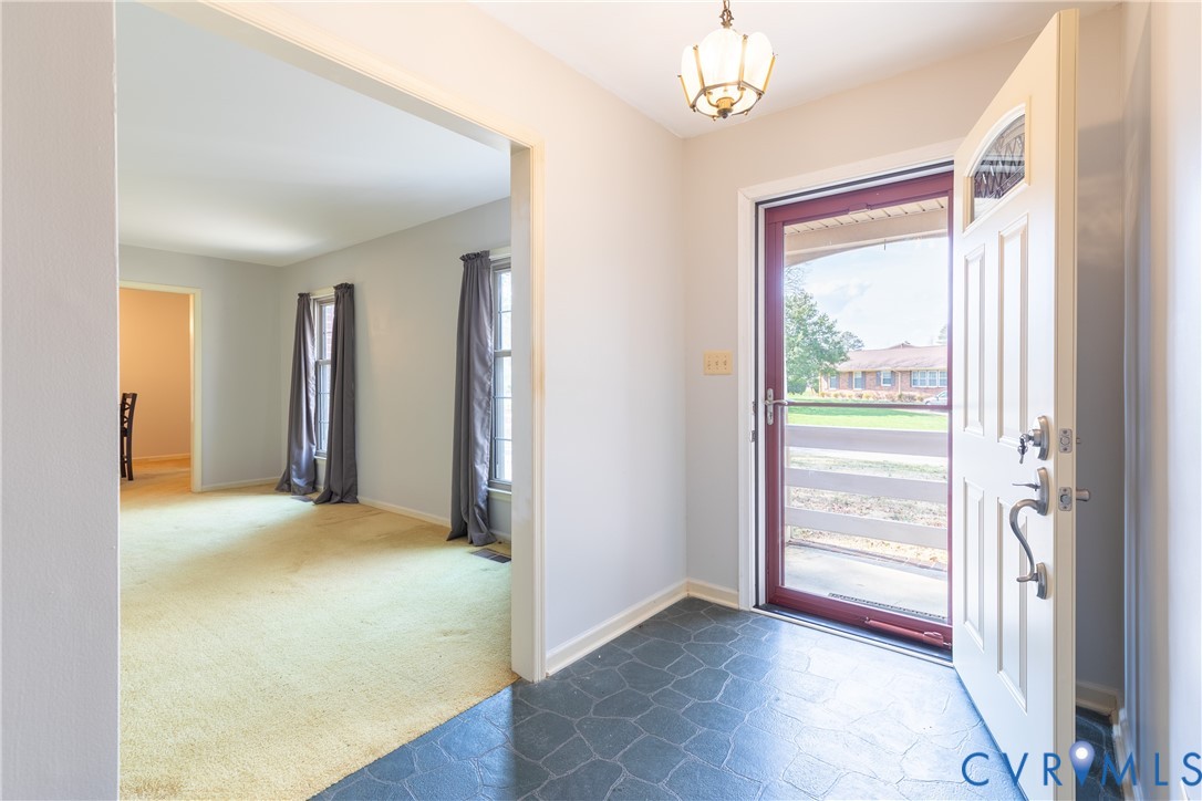 3317 Hastings Road Petersburg, VA 23805 - Photo 4 of 25 wooden floor in an empty room with a window