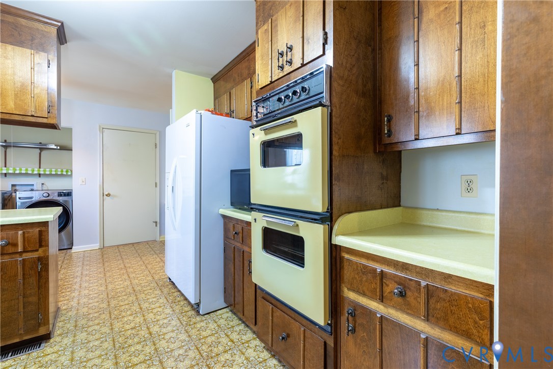 3317 Hastings Road Petersburg, VA 23805 - Photo 9 of 25 a kitchen with stainless steel appliances granite countertop a stove and a microwave