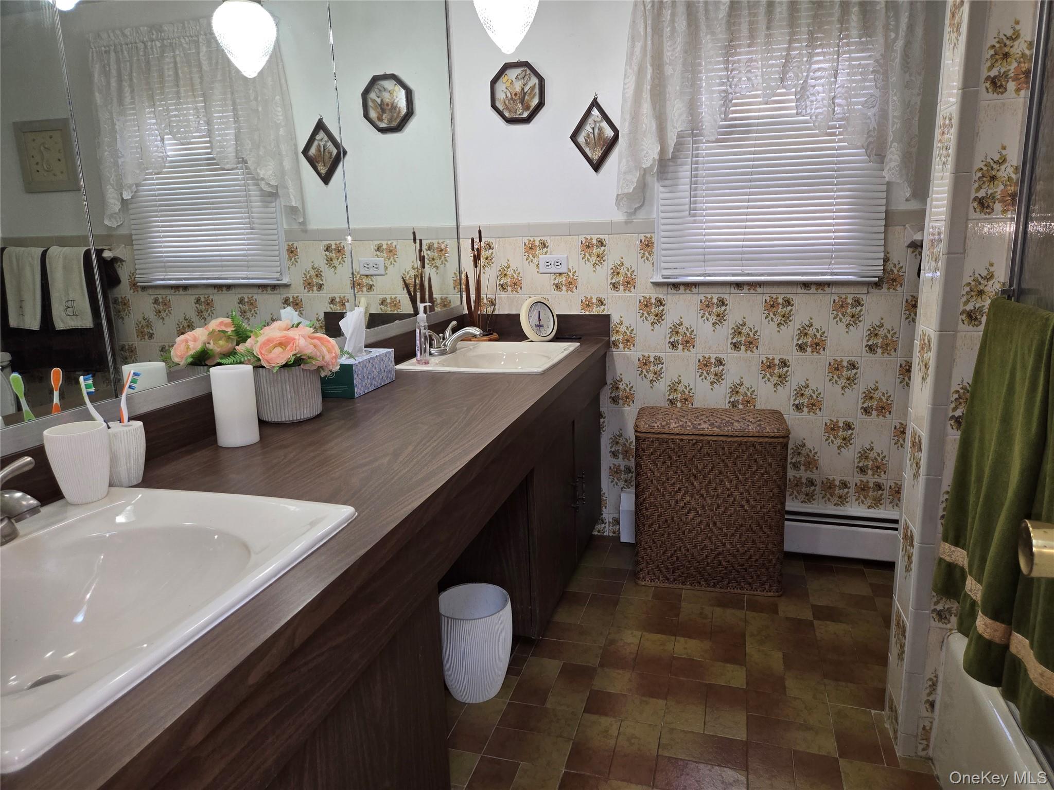 810 Fenimore Road Mamaroneck, NY 10543 - Photo 17 of 33 a kitchen with stainless steel appliances a sink a stove and a refrigerator