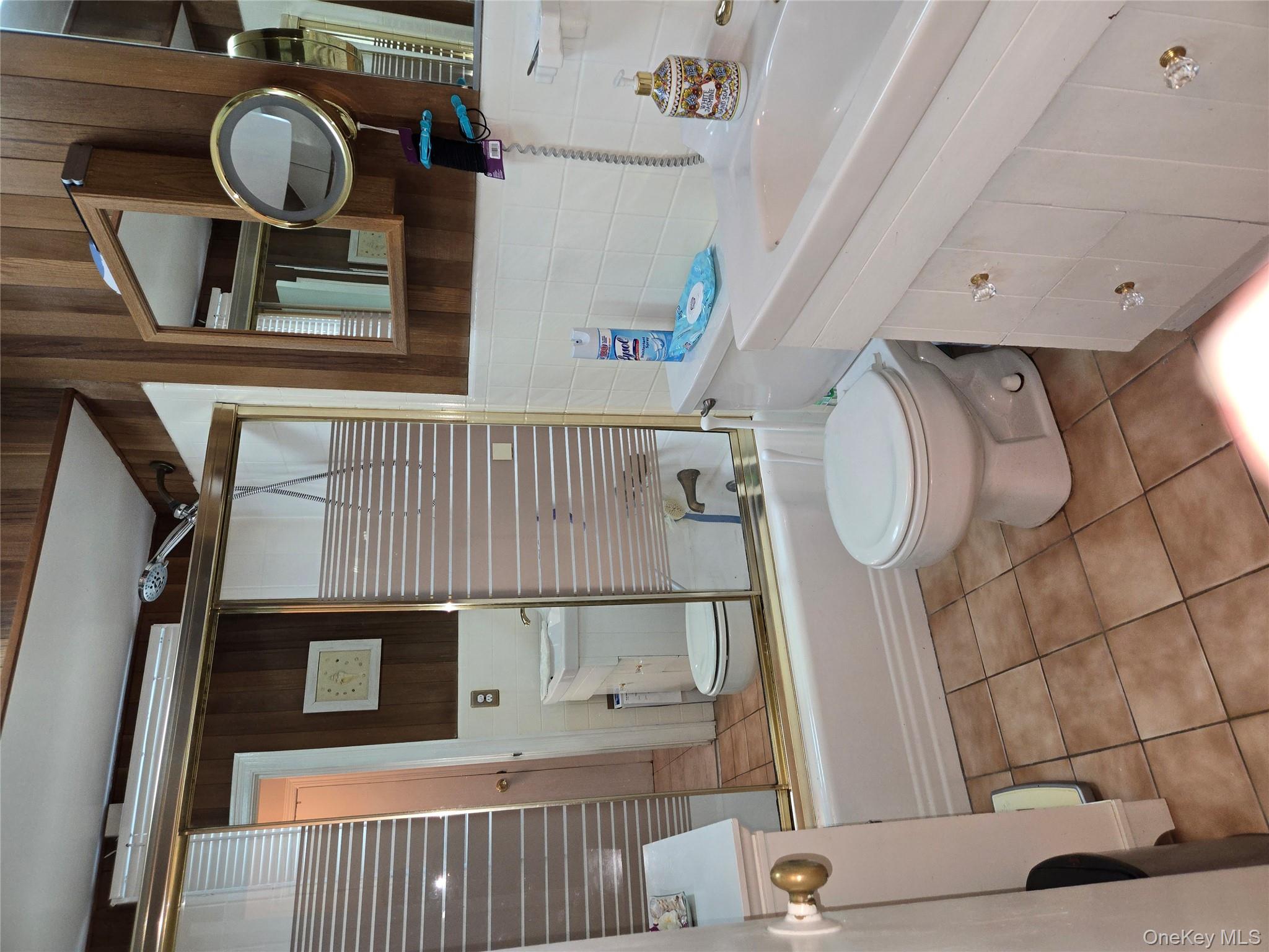 810 Fenimore Road Mamaroneck, NY 10543 - Photo 21 of 33 a bathroom with a sink toilet and shower