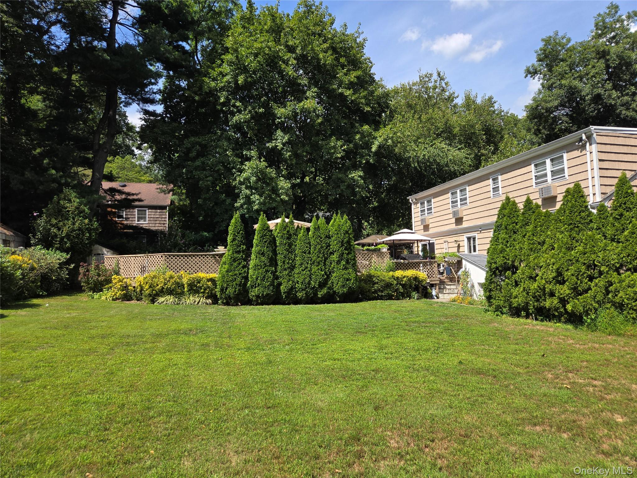 810 Fenimore Road Mamaroneck, NY 10543 - Photo 30 of 33 a view of a house with a yard