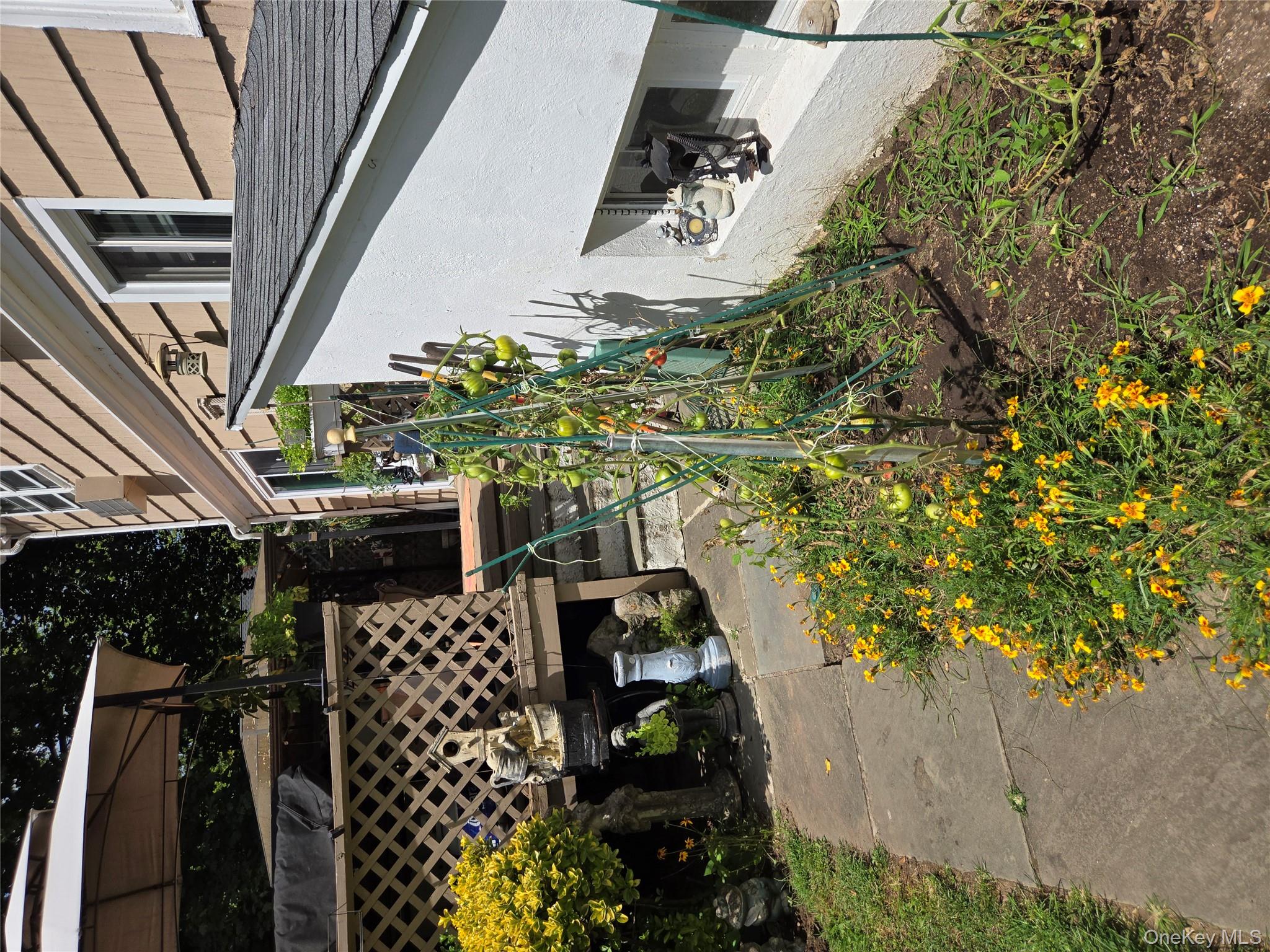 810 Fenimore Road Mamaroneck, NY 10543 - Photo 32 of 33 a side view of a house with a yard