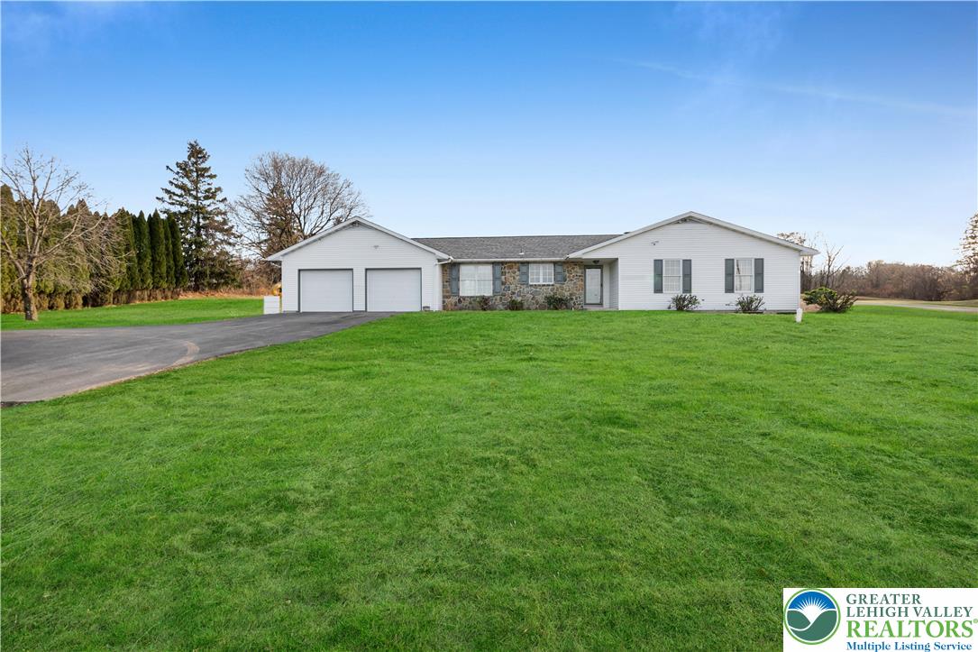 a big house with a big yard and large trees