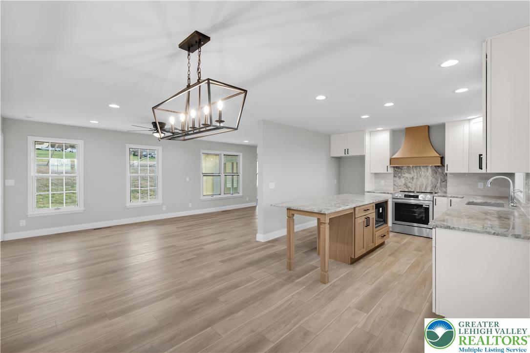 670 Cider Press Road Easton, PA 18042 - Photo 15 of 48 a view of a kitchen with granite countertop stainless steel appliances and wooden floor