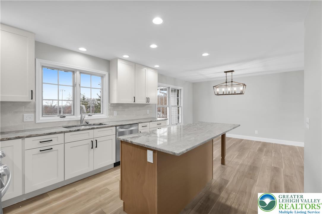 670 Cider Press Road Easton, PA 18042 - Photo 16 of 48 a kitchen with a sink window and cabinets