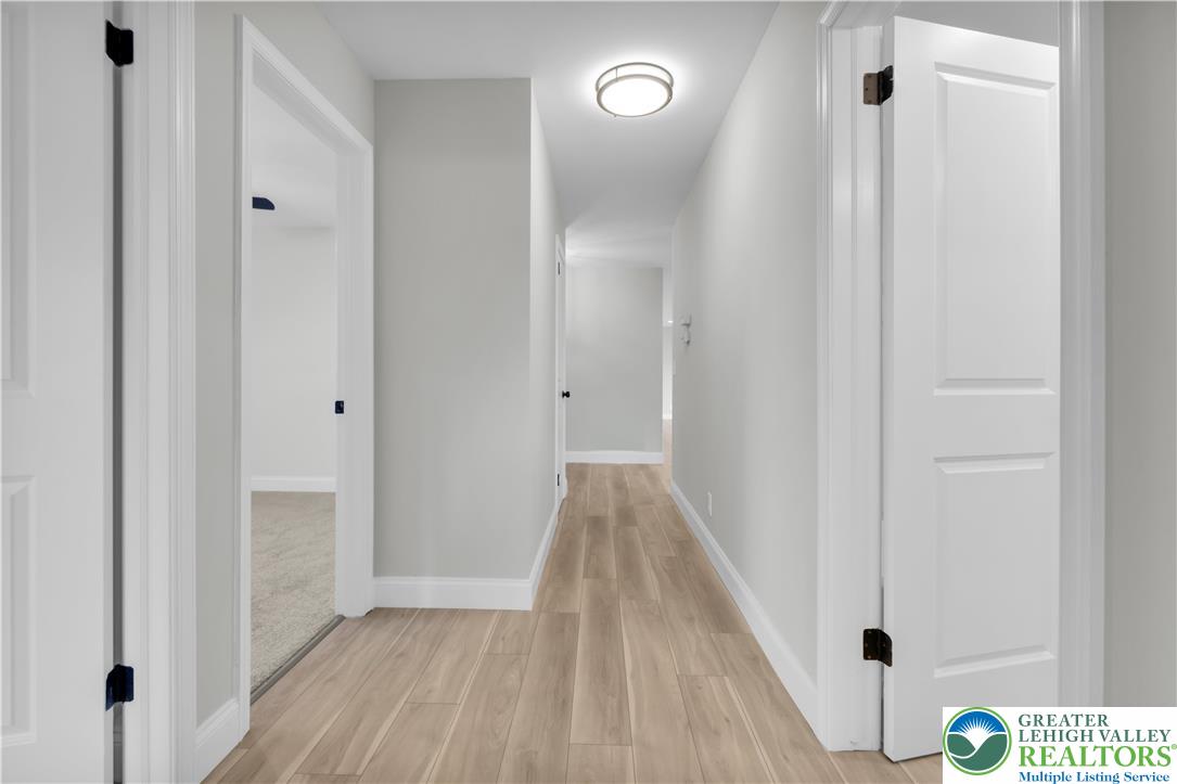670 Cider Press Road Easton, PA 18042 - Photo 18 of 48 a view of a hallway with wooden floor