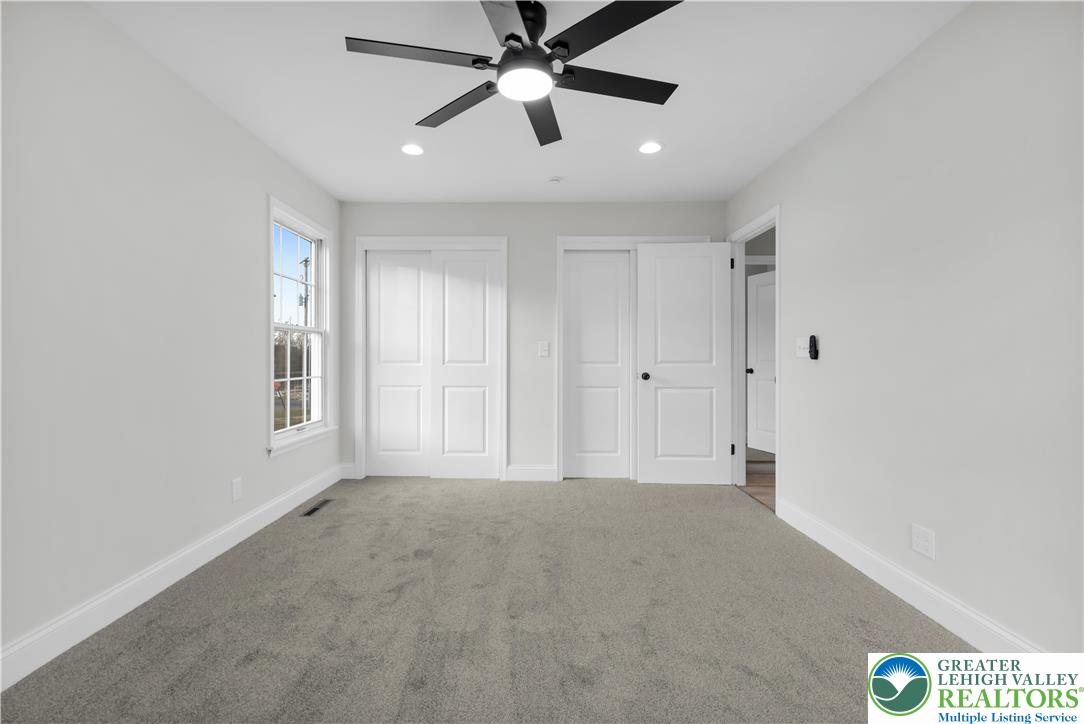 670 Cider Press Road Easton, PA 18042 - Photo 19 of 48 a view of an empty room and a ceiling fan