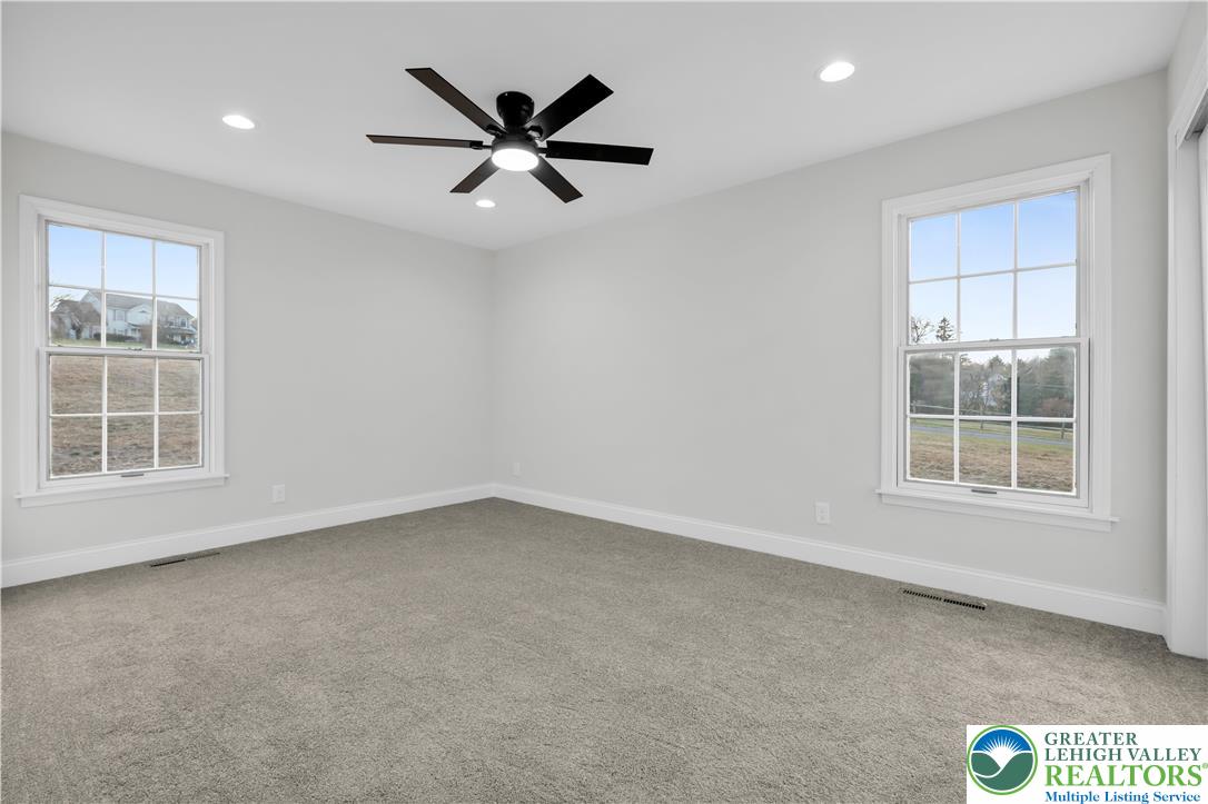 670 Cider Press Road Easton, PA 18042 - Photo 20 of 48 an empty room with windows and fan
