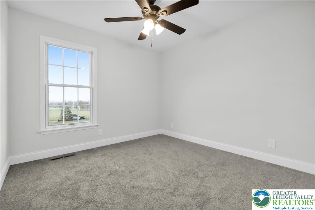 670 Cider Press Road Easton, PA 18042 - Photo 23 of 48 an empty room with windows and fan