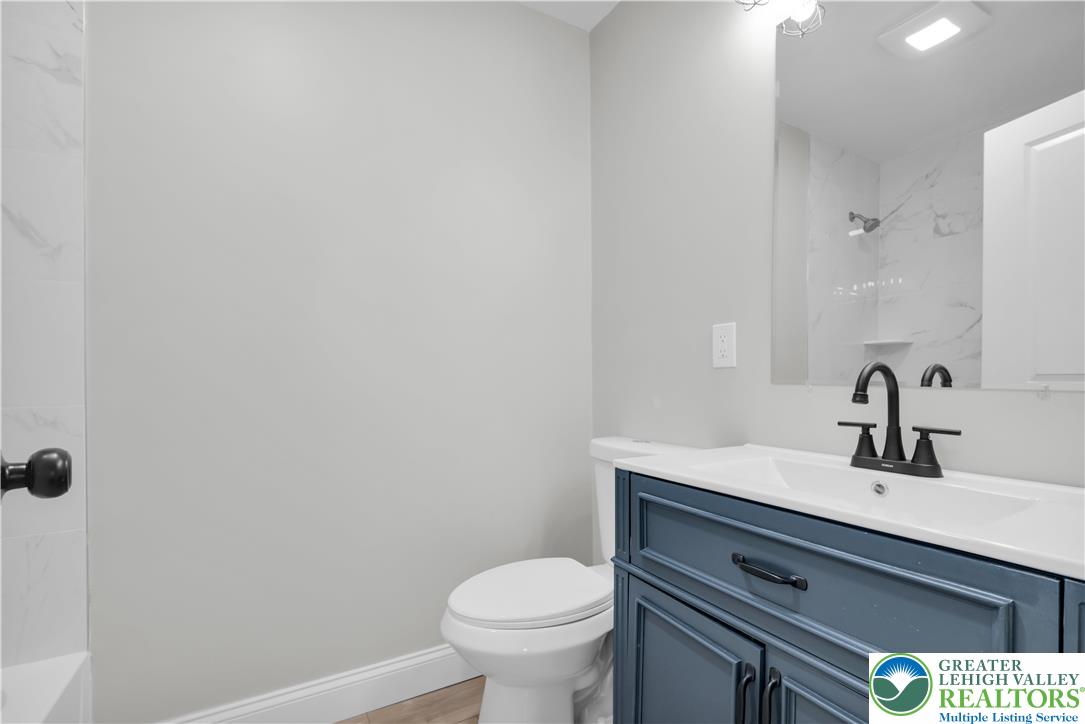 670 Cider Press Road Easton, PA 18042 - Photo 25 of 48 a bathroom with a sink a toilet and mirror