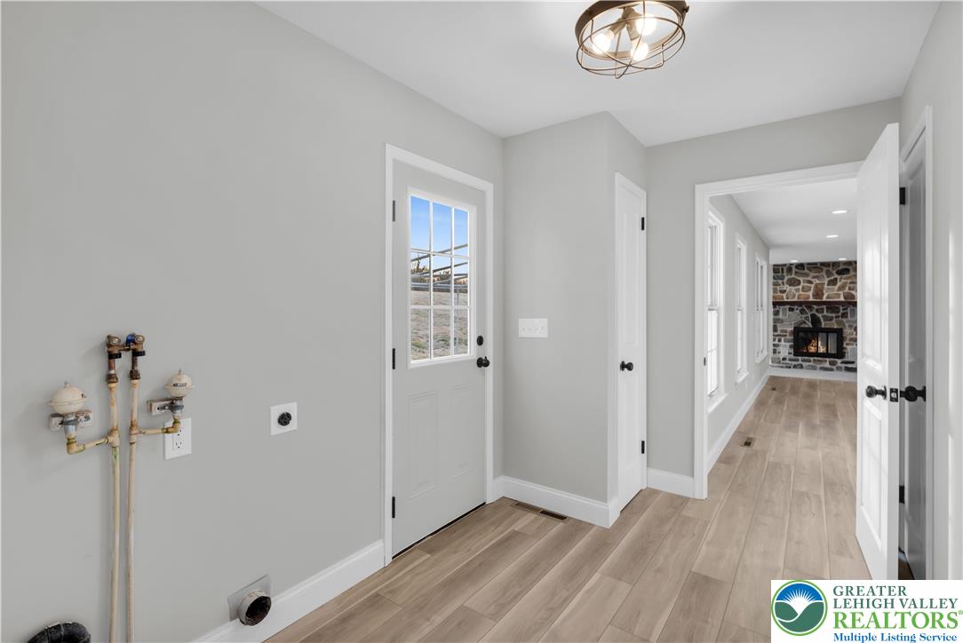 670 Cider Press Road Easton, PA 18042 - Photo 29 of 48 a view of a hallway with wooden floor and closet