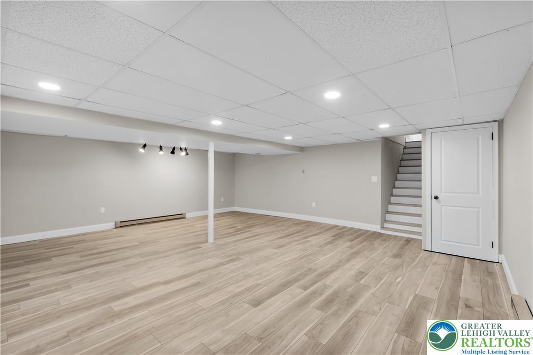 670 Cider Press Road Easton, PA 18042 - Photo 31 of 48 a view of an empty room with wooden floor