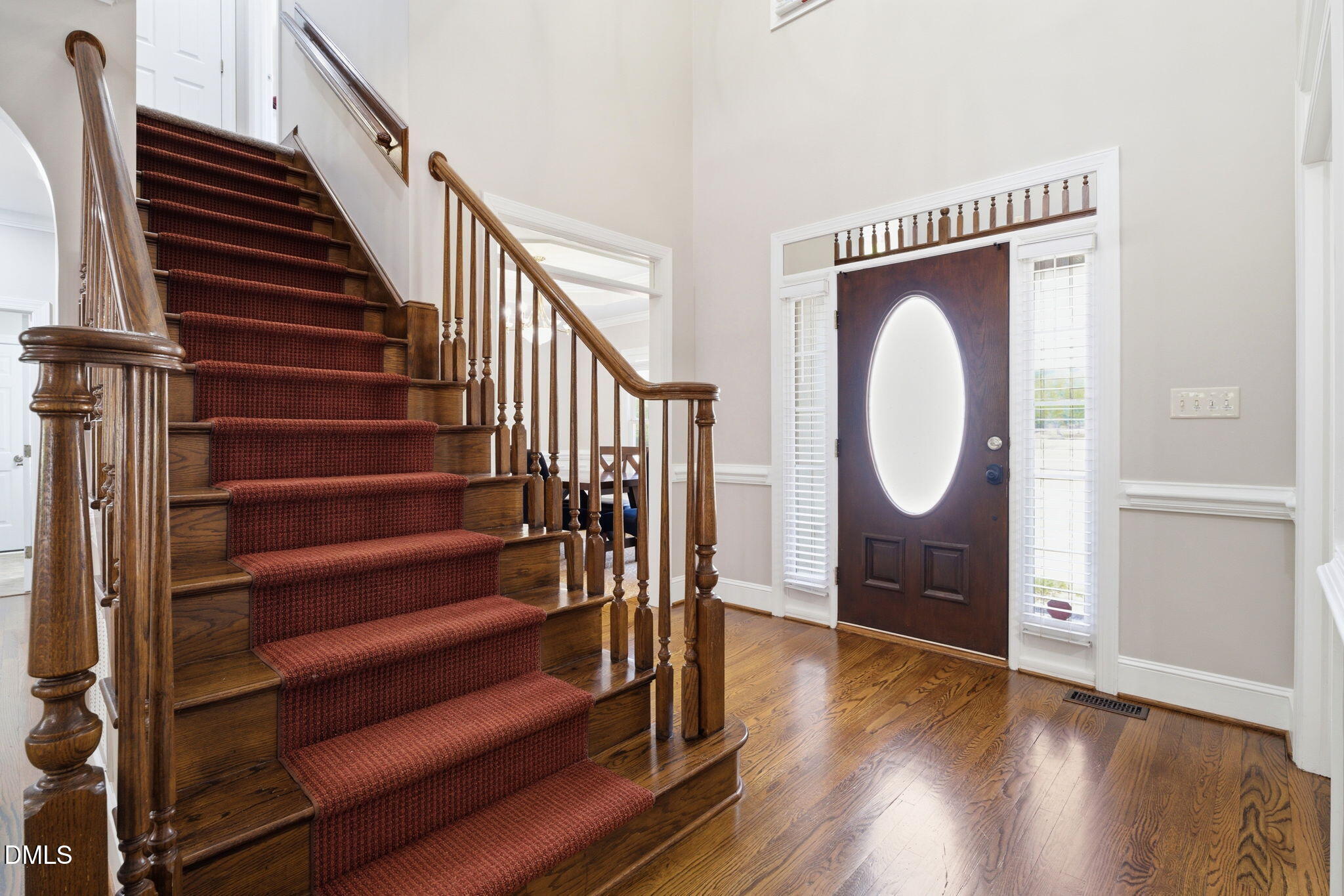 5416 Pulley Town Road Zebulon, NC 27597 - Photo 12 of 74 a view of a livingroom with wooden floor and staircase