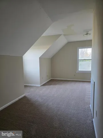 a bathroom with a toilet a sink and bathtub