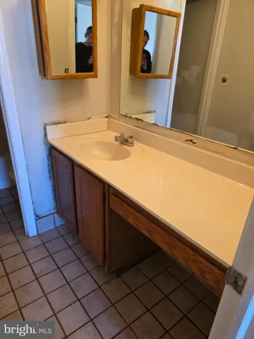 a bathroom with a toilet and a bathtub