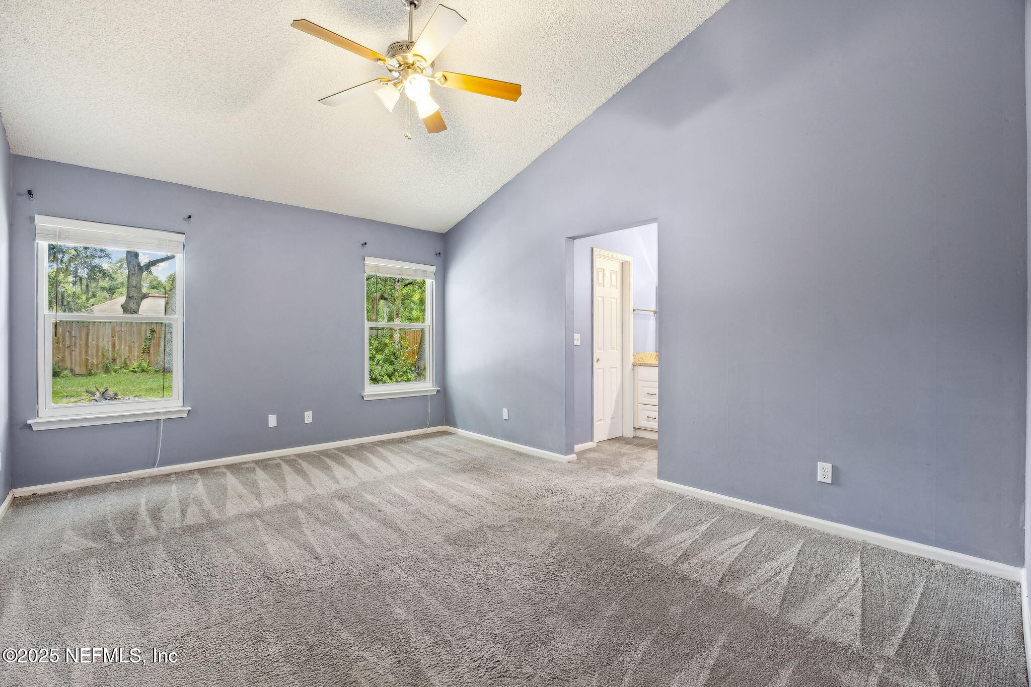 86001 Grant Place Yulee, FL 32097 - Photo 11 of 26 an empty room with windows and fan