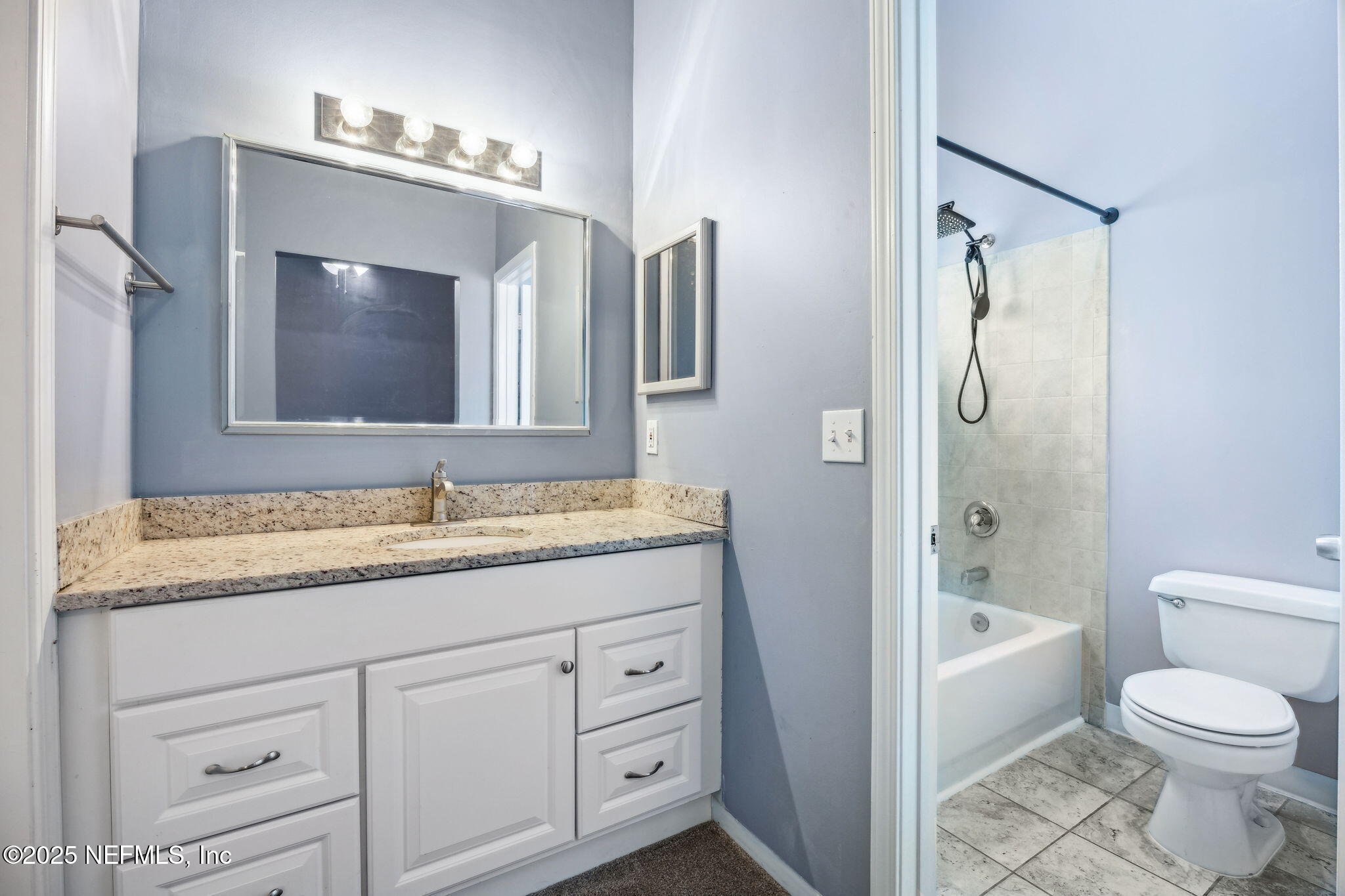 86001 Grant Place Yulee, FL 32097 - Photo 13 of 26 a bathroom with a granite countertop sink toilet and shower