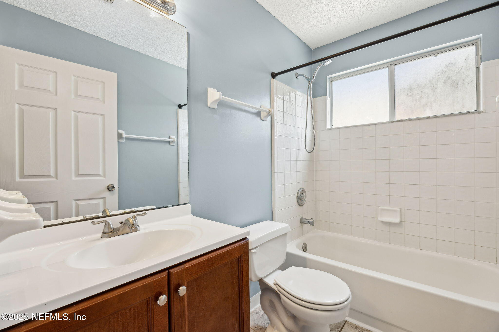 86001 Grant Place Yulee, FL 32097 - Photo 17 of 26 a bathroom with a granite countertop sink toilet and shower