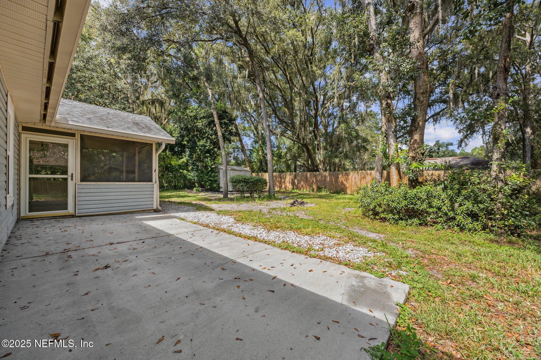 86001 Grant Place Yulee, FL 32097 - Photo 21 of 26 a view of a house with backyard and trees