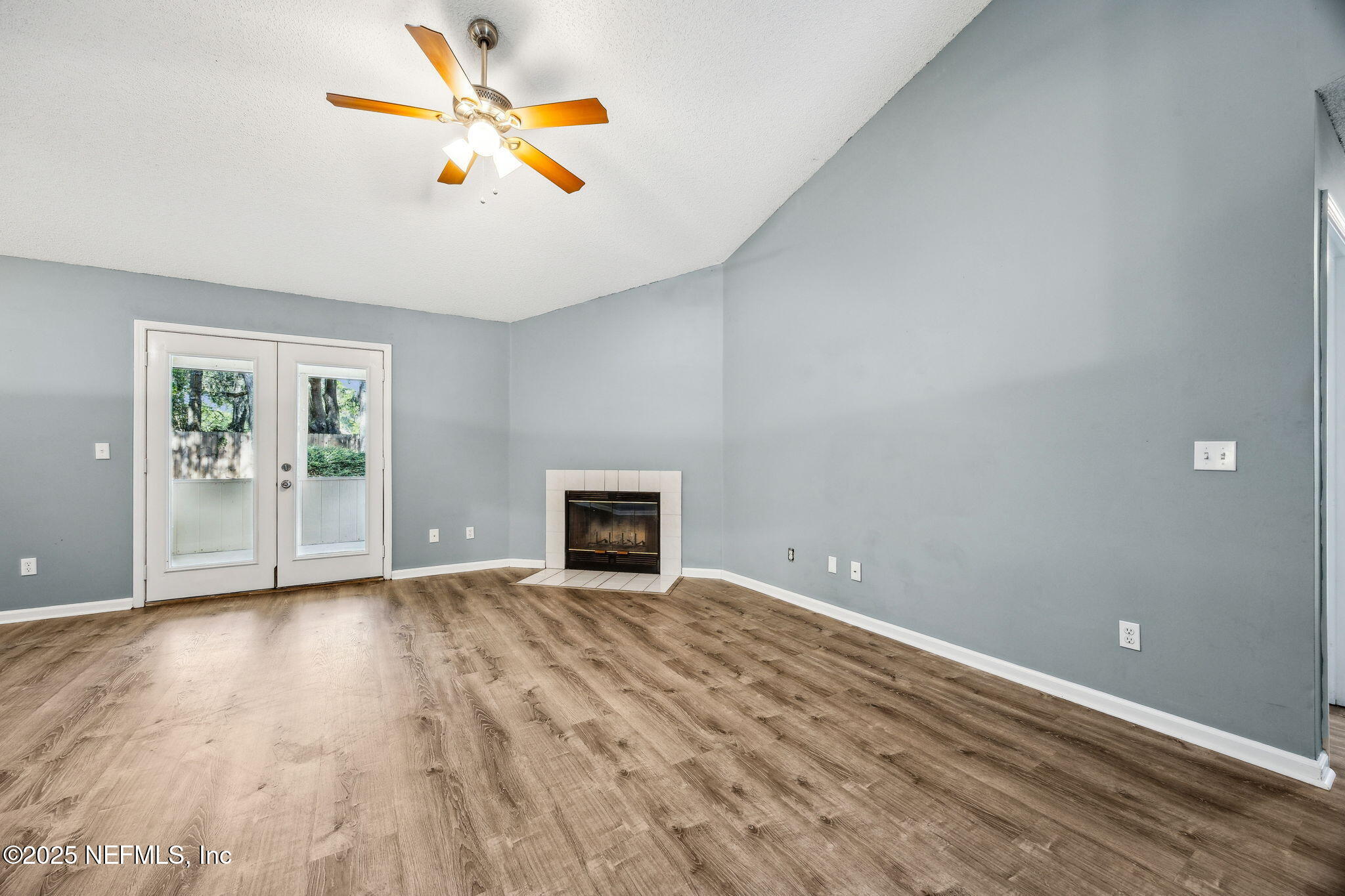 86001 Grant Place Yulee, FL 32097 - Photo 5 of 26 wooden floor in an empty room with a window