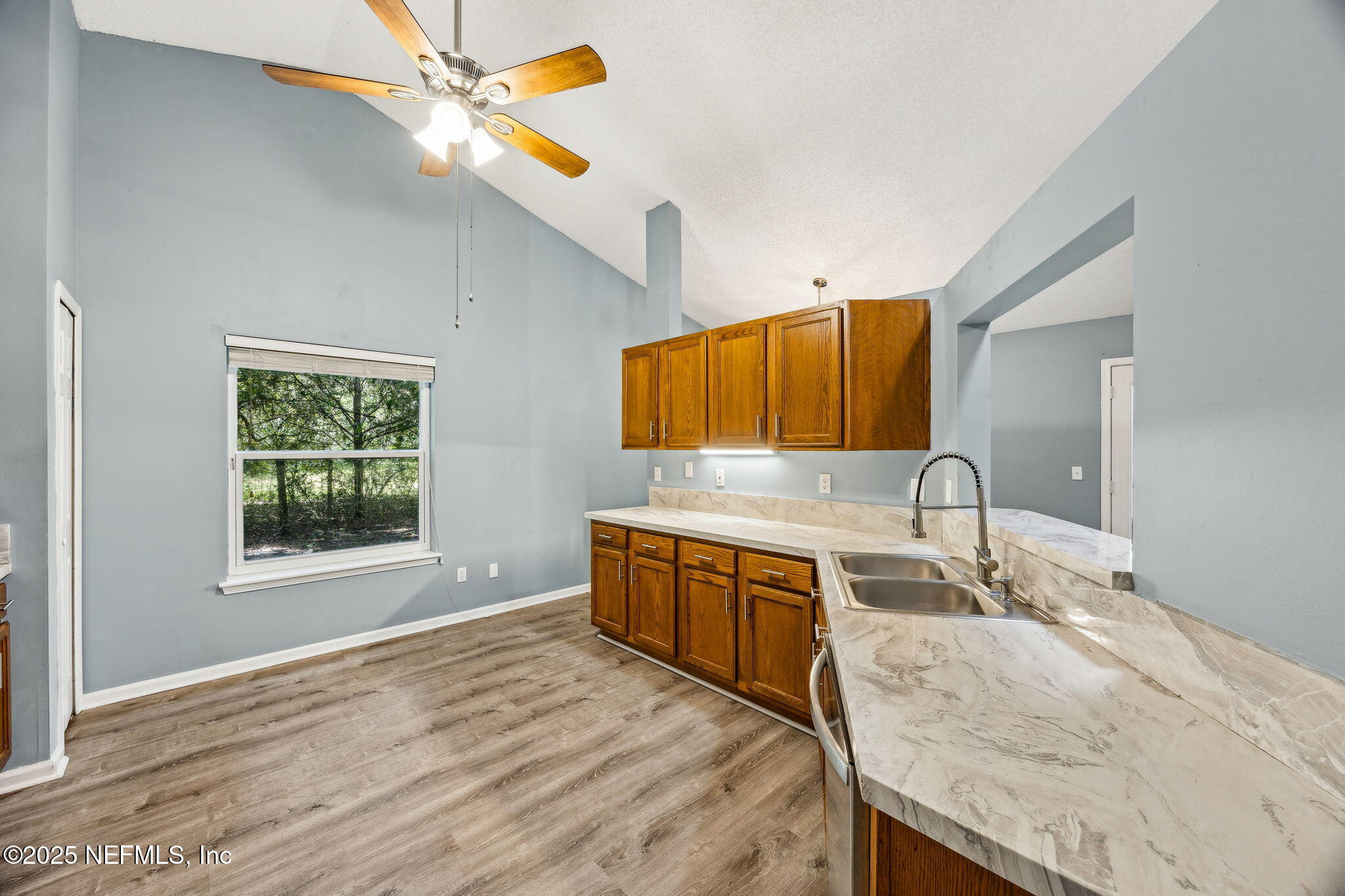 86001 Grant Place Yulee, FL 32097 - Photo 9 of 26 a spacious bathroom with a granite countertop double vanity sink a mirror and a bathtub