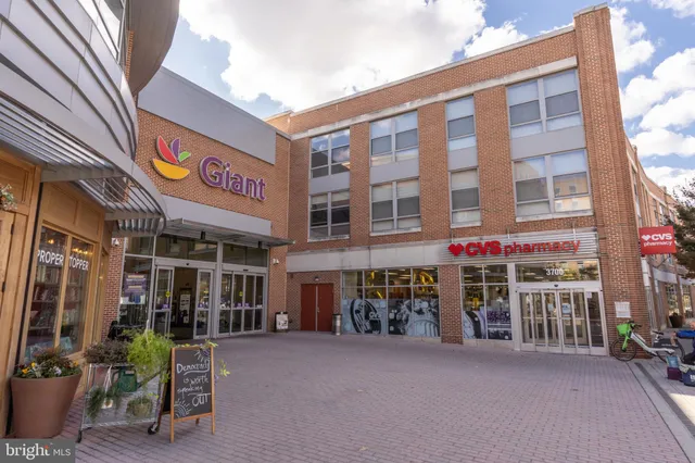 a view of a building with sitting area