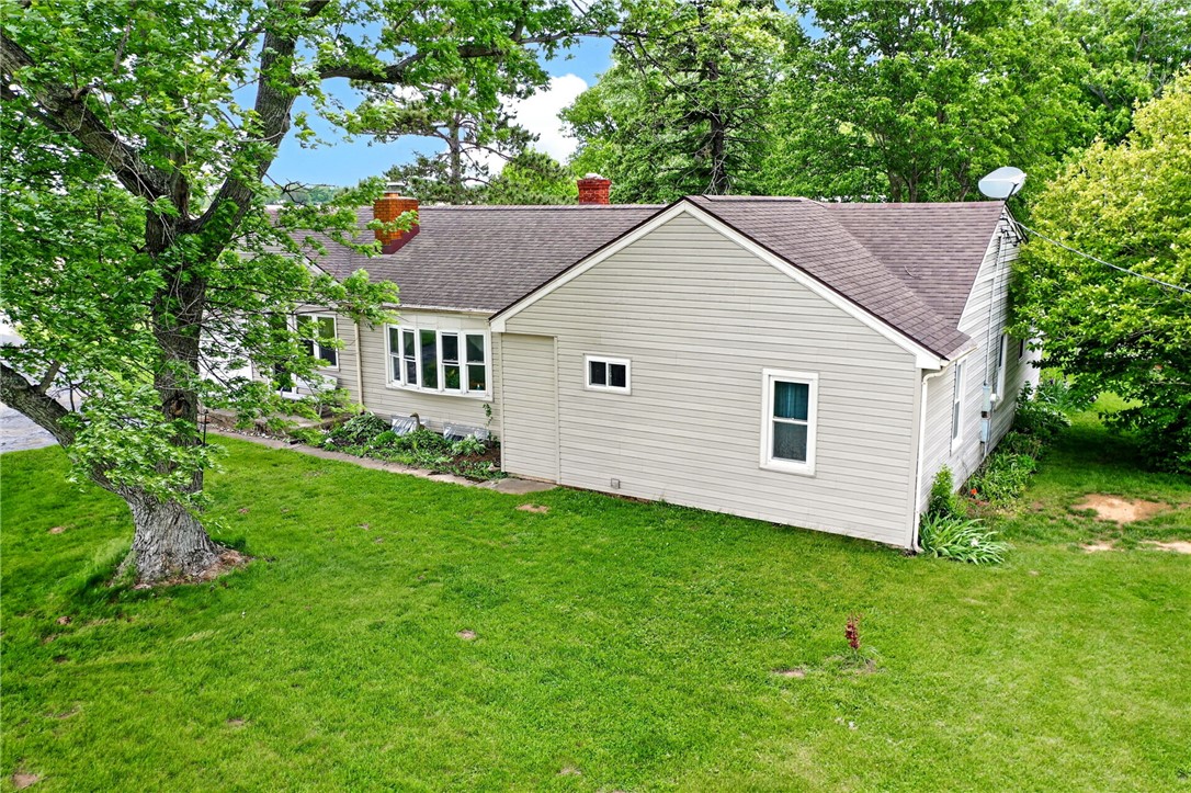 2470 Clark Run Road Xenia, OH 45385 - Photo 47 of 57 This charming home offers a serene escape with its inviting facade and lush surroundings.