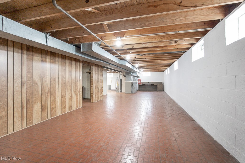 4569 McFarland Road Cleveland, OH 44121 - Photo 23 of 29 Basement with water heater and brick floor
