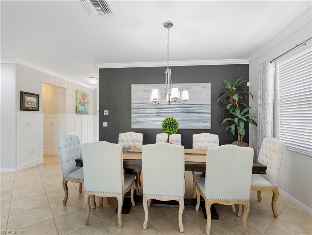 21116 Bella Terra Boulevard Estero, FL 33928 - Photo 12 of 49 a view of a dining room with furniture window and outside view