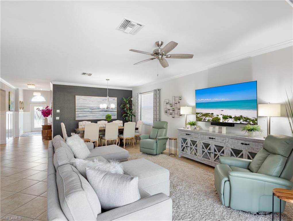 21116 Bella Terra Boulevard Estero, FL 33928 - Photo 13 of 49 a living room with furniture and a large window