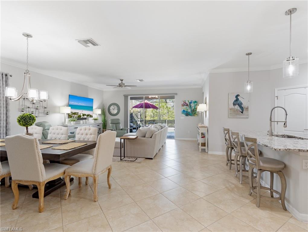 21116 Bella Terra Boulevard Estero, FL 33928 - Photo 4 of 49 a living room with fireplace furniture and a wooden floor